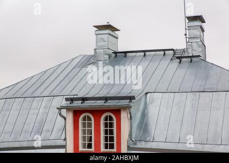 Metal zinc roof on house in Finland Stock Photo