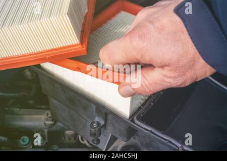 Car engine air filter replacement Stock Photo