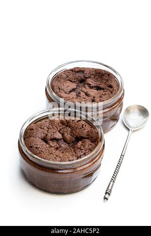 Homemade  delicious chocolate souffle in glass jars isolated on white Stock Photo