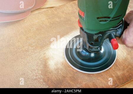 Sander machine on wooden background Stock Photo