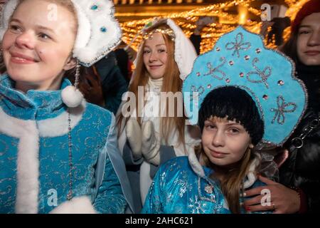 Moscow, Russia. 27th of December, 2019 People dressed as Father Frost (Russian Santa Claus) and Santa Claus take part in a parade in central Moscow as part of the Journey to Christmas winter festival, Russia Stock Photo