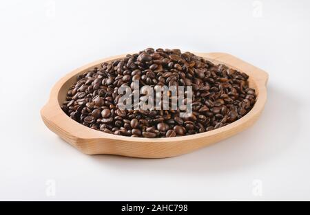 Roasted coffee beans on wooden tray Stock Photo