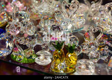 Original Bohemian art glass figures and glassware on display in czech souvenir shop Stock Photo