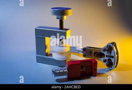 Mini vice to screw on watch lid Stock Photo