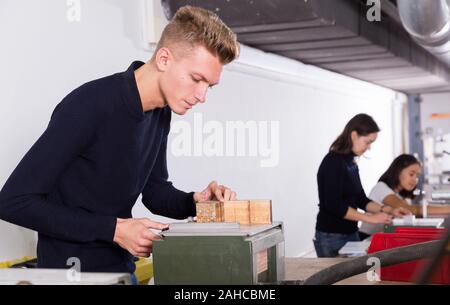 Young architect planning creation of new architectural model in design bureau Stock Photo