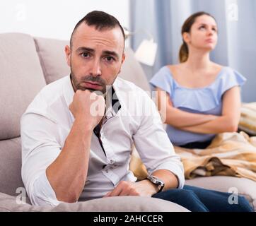 Sad male is depressing and husband is supporting him at home. Stock Photo