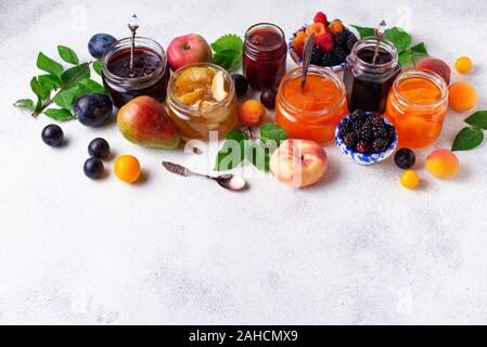 Assortment of different jams in jars Stock Photo