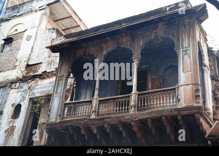 Old abandoned balcony with arches in a building in Old Delhi India Stock Photo