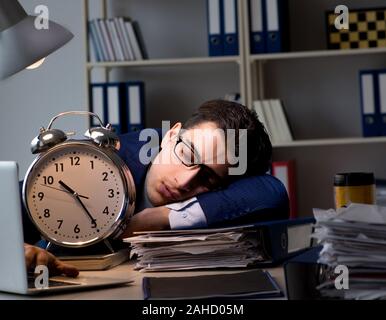 The businessman falling asleep during long hours in office Stock Photo