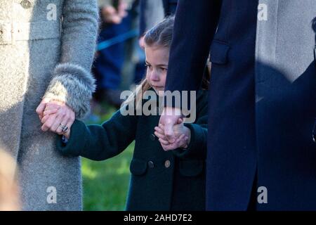 Picture dated December 25th shows  Princess Charlotte holding hands at St Mary Magdalene Church in Sandringham, Norfolk. Stock Photo