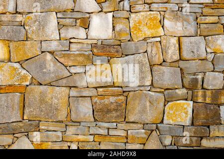 Old stone brick wall pattern texture background. Old wall of ancient architecture. Background of ancient stone wall. Texture of old brick. Roman architecture. Old wall made of the Jerusalem stone Stock Photo