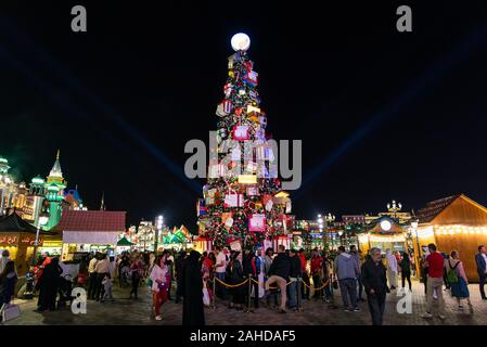 Dubai, United Arab Emirates - December 26, 2018: Global village with big Christmas tree and winter holidays decorations in Dubai, UAE. One of the most Stock Photo