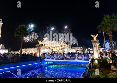 Dubai, United Arab Emirates - December 26, 2018: People enjoying fireworks in Duabai Global village at one of the most visited tourist attractions in Stock Photo