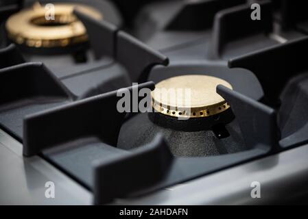 Modern and professional food industry equipment - close-up of gas burners in cooking kitchen Stock Photo