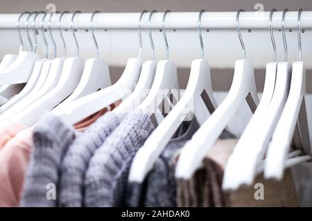 Female hanging clothes arranged on hangers in the wardrobe ( selective focus) Stock Photo