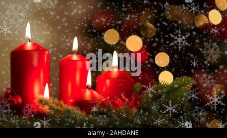 Holiday decoration - Romantic glowing candles on a background of beautiful bokeh lights with snowflakes (mixed) Stock Photo