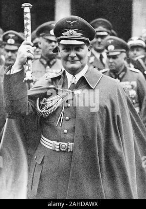Hermann Goering (1893-1946), holding up his Fieldmarshall's baton at Air Force day parade. March 1, 1938 Stock Photo