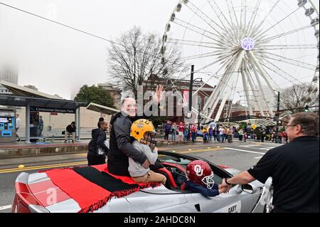 Atlanta, United States. 28th Dec, 2019. Peach Bowl President and CEO Gary Stokan greets LSU Tigers and Oklahoma Sooners fans during the Chick-fil-A Peach Bowl Game Day Parade before an NCAA semifinal football game in Atlanta, December 28, 2019. Photo by David Tulis/UPI Credit: UPI/Alamy Live News Stock Photo