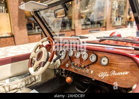 Interior old retro car convertible with wood panel. Stock Photo