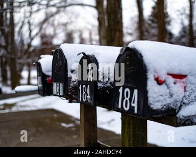 Snow Covers Some Mailboxes In the Winter Stock Photo