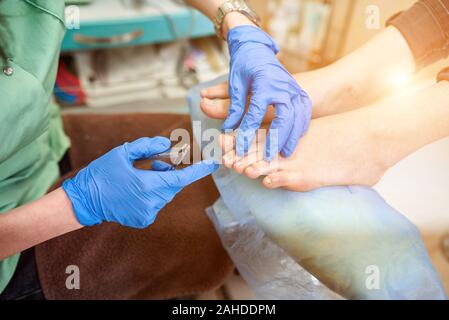 Close up. Patient on medical procedure, visiting podiatrist. Foot treatment in SPA salon. Podiatry clinic. Stock Photo