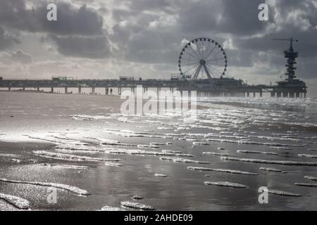 Scheveningen, the Netherlands - October 3, 2017:  Low angle view of pier of Scheveningen with ferris wheel and bungee tower, the Netherlands Stock Photo