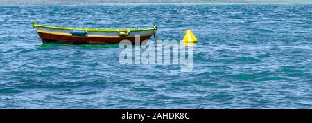 Little fisherman canoe at the brazilian coast town of Cabo Frio, Rio de Janeiro. Stock Photo