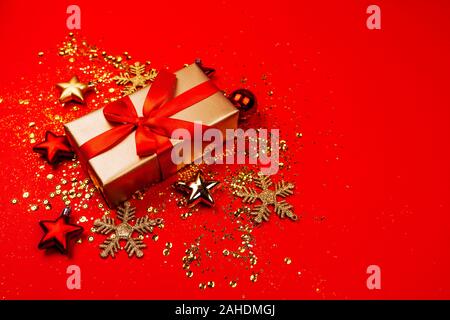 Red and gold christmas ornaments, frame with copy space, red background. Stock Photo