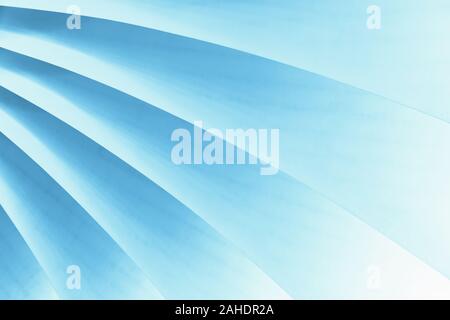 Soft curved pastel lines of blue form abstract background pattern Stock Photo