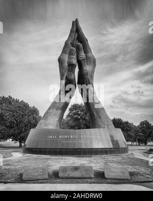 Praying Hands sculpture at the entrance to the campus of Oral Roberts University in Tulsa, Oklahoma Stock Photo