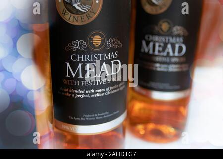 Bottles of Christmas Mead on sale at a market. An alcoholic drink created by fermenting honey with water and is the oldest alcoholic drink known. Stock Photo