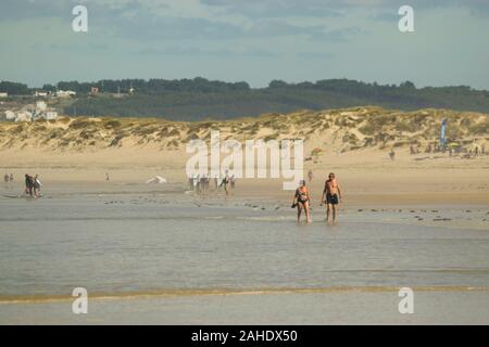 A middle aged couple paddle on Gamboa Beach Peniche Estremadura Portugal Stock Photo