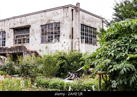 Bullet Holes on Building After War Stock Photo