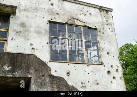Wall Riddled With Rifle Shots Stock Photo