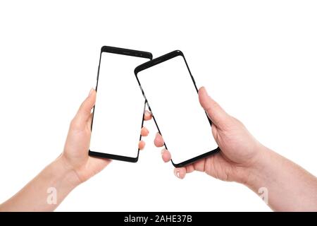 Two hands holding smartphones blank screen with modern frameless design ...