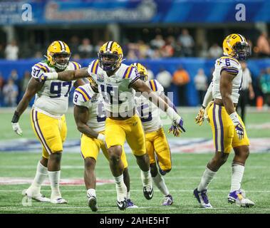 December 28, 2019: LSU's defense celebrates a sack lead by K'Lavon Chaisson (18), Patrick Queen (8), Kary Vincent Jr. (5), Jacob Phillips (6), and Glen Logan (97) during the Chick-Fil-A Peach Bowl Playoff Semifinal game between the Oklahoma Sooners and the LSU Tigers at the Mercedes Benz Stadium in Atlanta, GA. Jonathan Mailhes/CSM Stock Photo