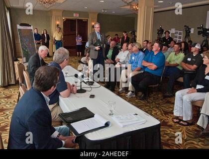 Dan Steinkruger, Executive Director, Farm Services Agency, Nebraska, offers advice and assistance available through the United States Department of Agriculture, Farm Services Agency associated with floodwaters along the Missouri River affecting Iowa and Nebraska. Seated to Steinkrugers’ right are John Berge, Executive Director, USDA National Food and Agriculture Council, Agriculture Secretary Tom Vilsack and Dayle Williamson, State Agriculture Representative for Senator Ben Nelson. USDA administers many programs to assist with recovery in rural areas reeling from natural disasters. USDA and th Stock Photo