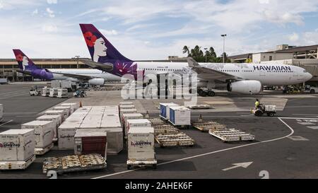 Hawaiian Airlines airplane at gate of Honolulu International Airport ...