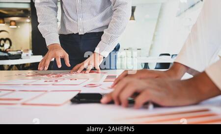 App developer Ux Ui designing with paper model on mobile application prepare, Close up shot. Stock Photo