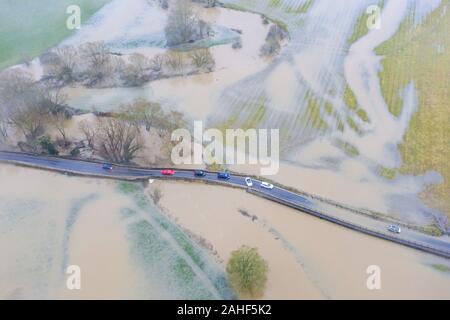 Lacock, Wiltshire, UK. 20th December 2019.  The Environment Agency has issued a red flood warning for Reybridge next to the historic village of Lacock Stock Photo