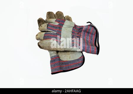 Used and worn work gloves isolated on a white background. Stock Photo