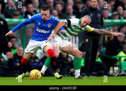 Ranger's Ryan Kent (left) and Celtic's Scott Brown battle for the ball during the Ladbrokes Scottish Premiership match at Celtic Park, Glasgow. Stock Photo