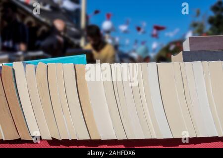 Old books are sold at Beyoglu festival. The festival is held in October. Blurred background. Stock Photo