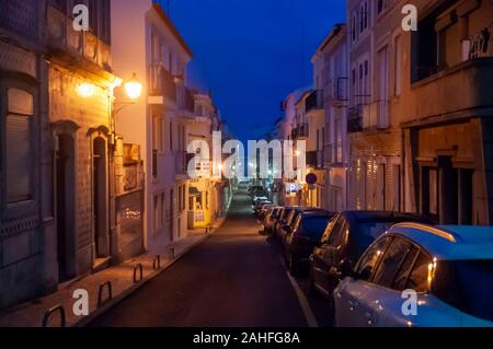 Night photography of a narrow alley in old town Nazare, Portugal Stock Photo