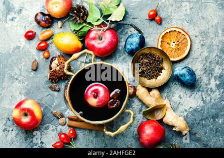 Alcoholic fruit drink sangria.Red wine and autumn fruits on the table. Stock Photo