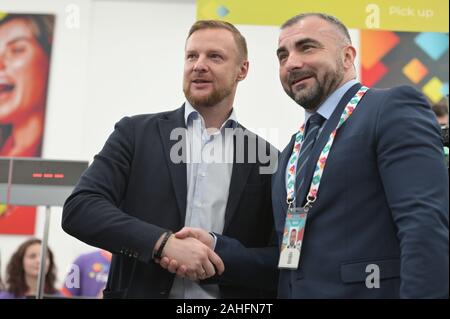 St. Petersburg, Russia - December 3, 2019: Ex-goalkeeper of the Russian national team Vyacheslav Malafeev presents the first Fan ID to football fans during the opening of the Fan ID Center for the UEFA Euro 2020. Three group matches and quarterfinal will be held in Saint Petersburg