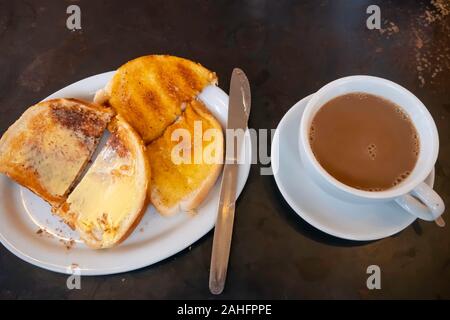 Two buttered slices of white bread toast a breakfast snack here served in a North Yorkshire café tea room Stock Photo