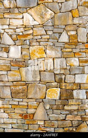 Surface of stone wall. Old stone brick wall pattern texture background. Old wall of ancient architecture. Background of ancient stone wall. Texture of old brick. Roman architecture. Old stonewall Stock Photo