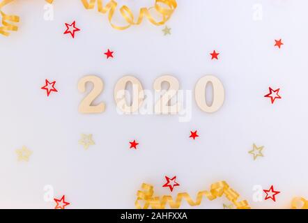 New Year background. Wood numbers 2020 and decorations. Stock Photo