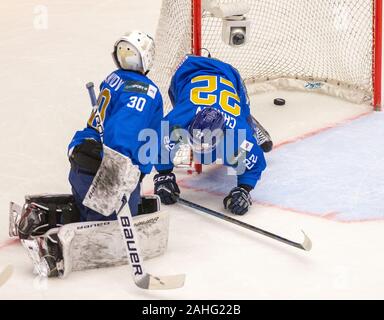 Trinec, Czech Republic. 29th Dec, 2019. L-R Roman Kalmykov and Maxim Chalov (both KAZ) in action during the 2020 IIHF World Junior Ice Hockey Championships Group A match between Kazakhstan and Finland in Trinec, Czech Republic, on December 29, 2019. Credit: Vladimir Prycek/CTK Photo/Alamy Live News Stock Photo